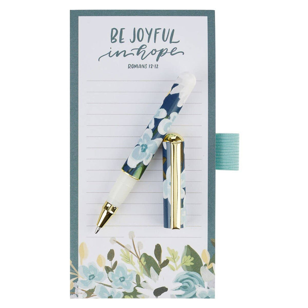 Floral pen and notebook set with motivational Bible quote on a white background