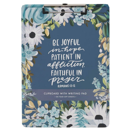 Clipboard with floral design and motivational Bible quote on a white background