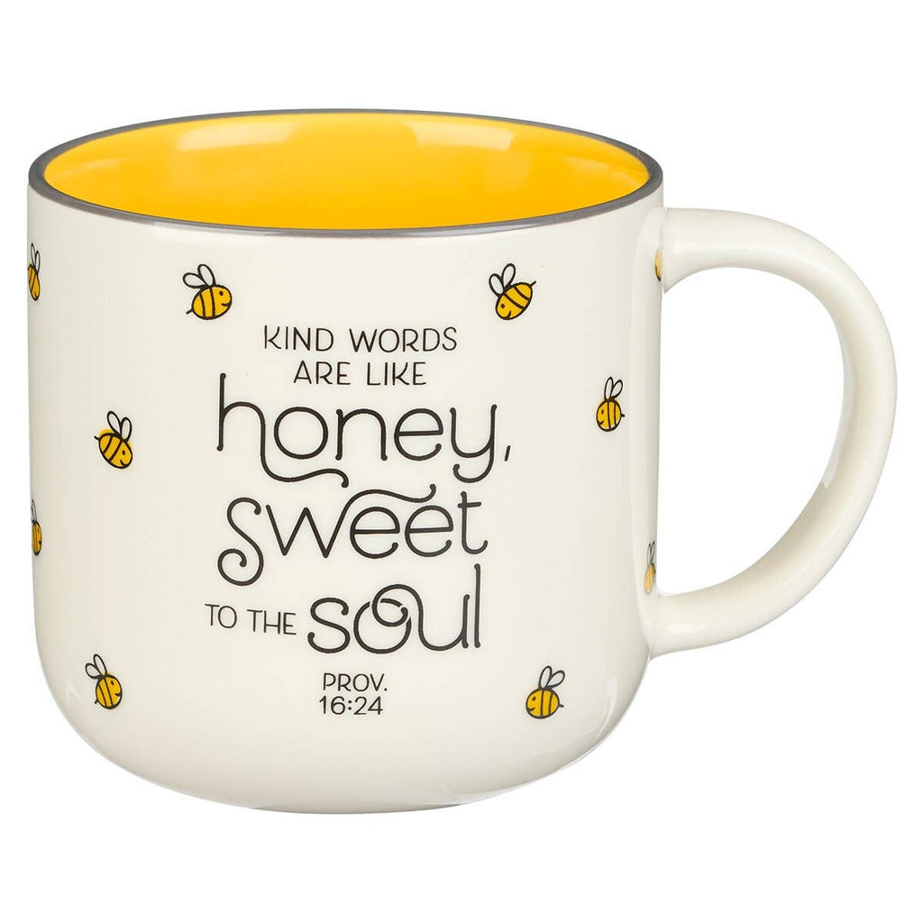 Mug with bee design and motivational quote on a white background