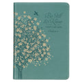 Teal notebook journal with floral design and inspirational Bible quote on a white background