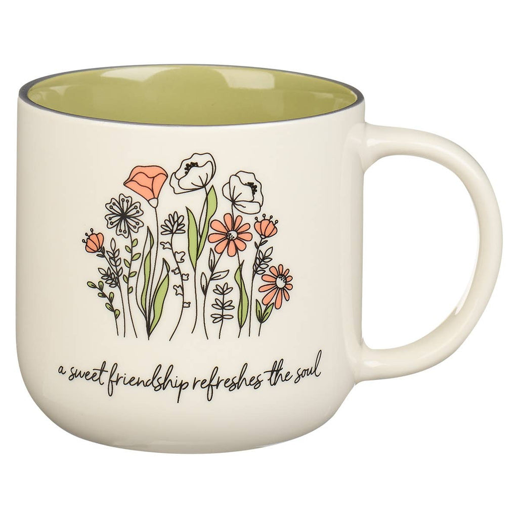 Mug with floral design and text on a white background