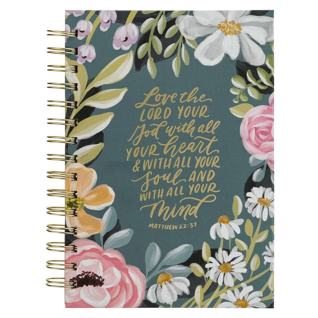 Notebook with floral design and Bible verse text on a white background