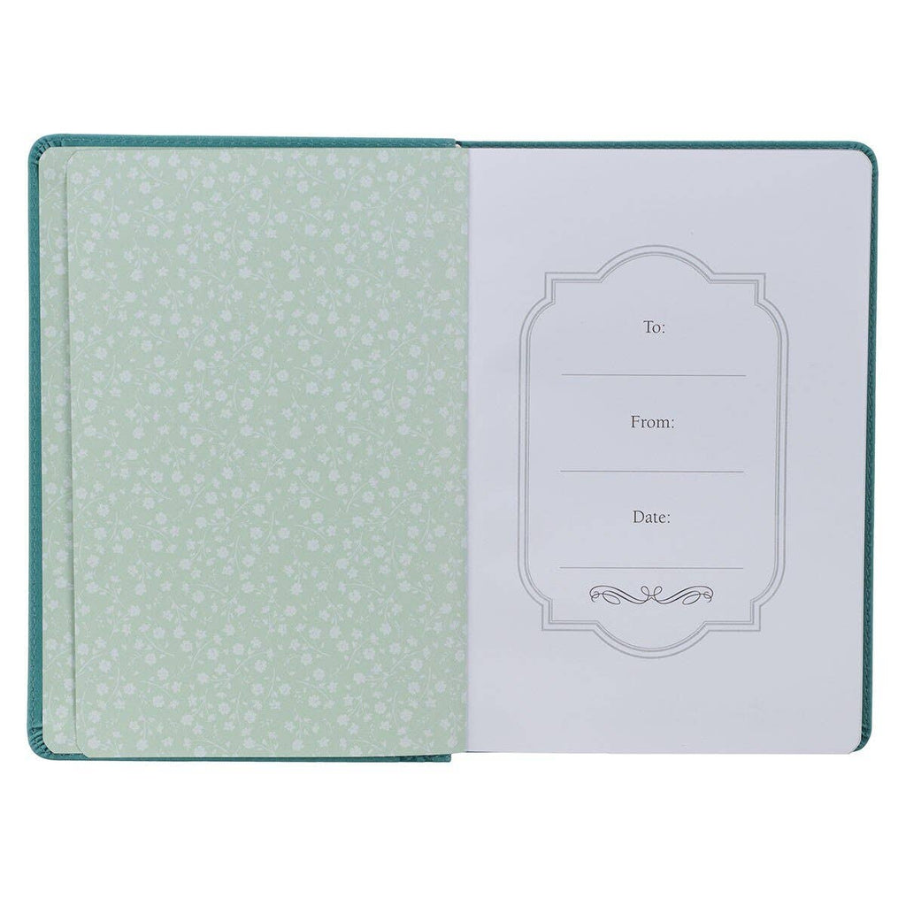 Open journal with green floral interior and design on a white background