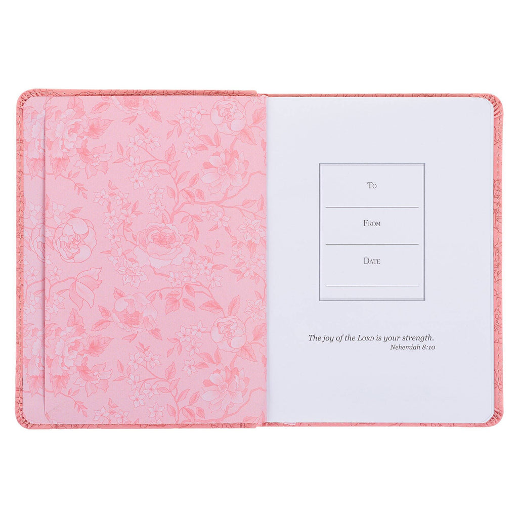 Floral-patterned open journal with a white interior on a white background