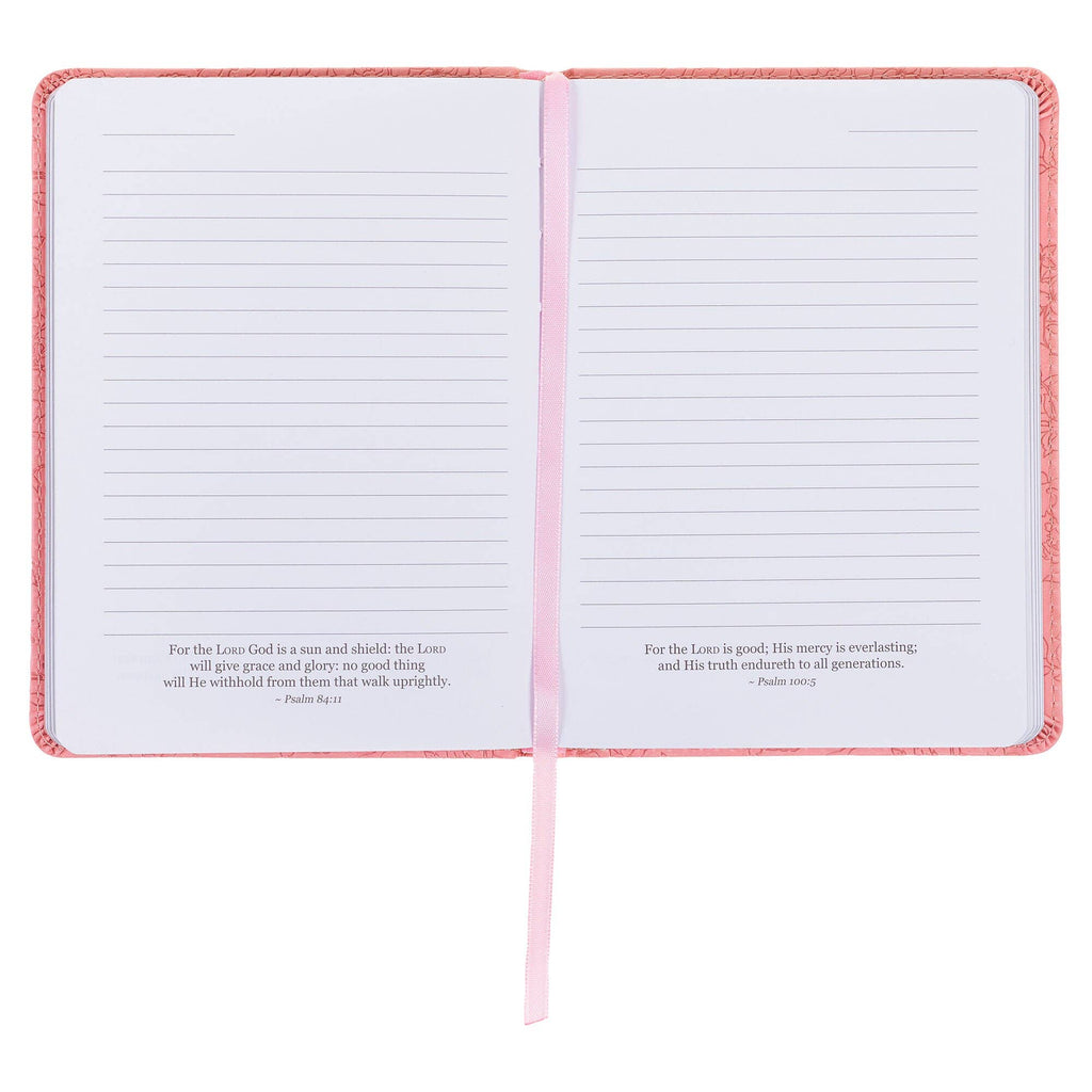 Open notebook with pink edges on a white background