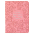 Pink notebook journal with floral design and Bible text on a white background