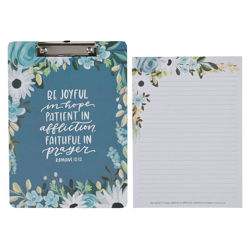 Floral clipboard with motivational Bible quote and matching notepad on a white background